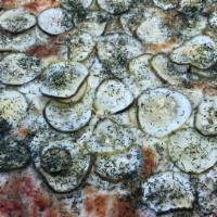 Dill Pickle Pizza Rhino's · White garlic pizza with mozzarella cheese topped with dill pickle slices and dill weed sprin...