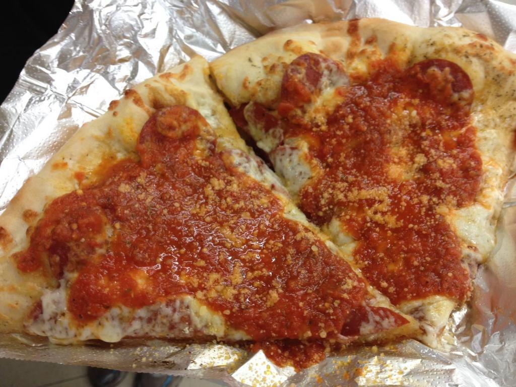 Grandma's Pizza · White garlic sauce then pepperoni, mozzarella and topped with fresh warm pizza sauce and Parmesan.