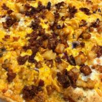 Loaded potato pizza · Garlic sauce, mozzarella cheese, French fries, cheddar cheese, red onions, topped with crisp...