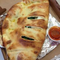 Steak Calzone · Steak, mozzarella and your choice of wing sauce with bleu cheese on the side.