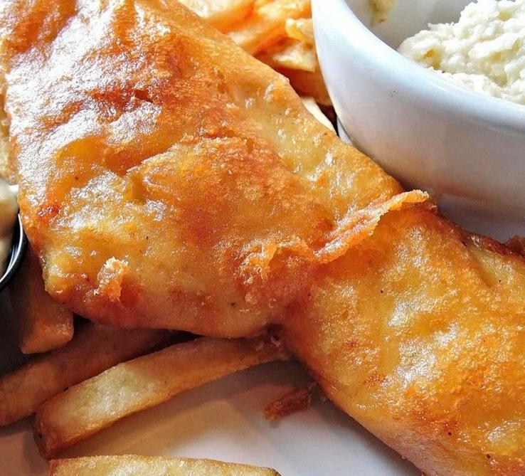 Daily Fish Fry · Golden fried beer-battered Icelandic haddock. Served with coleslaw, french fries, tartar sauce and lemon.