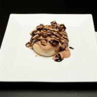 Cookie Monster Roll · Chocolate frosting topped with Chocolate Chip Cookie bites and Chocolate Sauce.