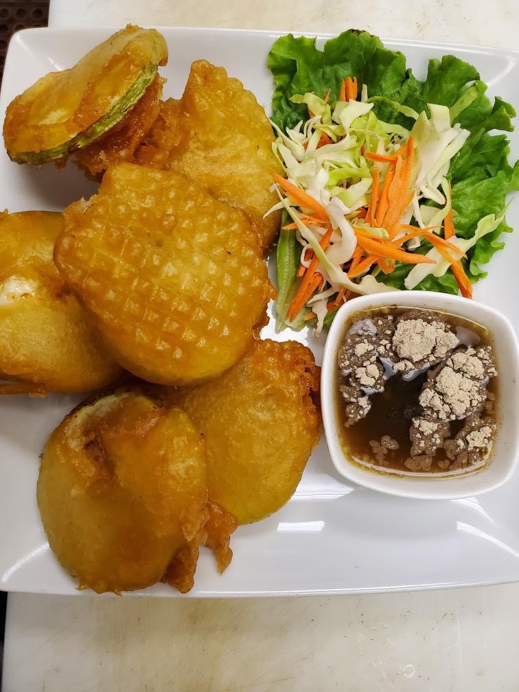 Fried Opo (6 pcs) · Deep fried young fresh opo, served with wann jale's sauce including fish sauce, crushed chili, fresh garlic, tamarind juice and roasted chick pea powder.