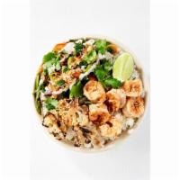 Coconut Tiger Shrimp Super Grain Bowl · Coconut tiger shrimp, red and white quinoa and farrow grain blend, grilled seasonal vegetabl...