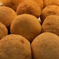 Rice Ball · One traditional arancino made with rice, mozzarella, sauteed beef in tomato sauce and peas f...