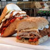 Franco Sandwich · Your choice of either breaded chicken cutlet or breaded eggplant with roasted peppers, fresh...