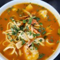 Sopa de Mariscos · Mixed seafood soup with spaghetti and vegetables.
