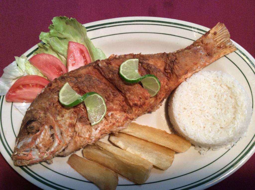 Pescado Frito · Entero. Fried whole fish. Served with salad and white rice.