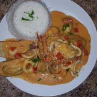 Pescado a lo Macho · Seafood combo includes dried fish, sauteed onions and tomatoes. Served with white rice.