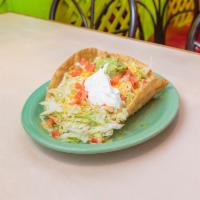 Chicken Taco Salad · Fresh meat topped with cheese and heated until the cheese is simmering, then topped again wi...