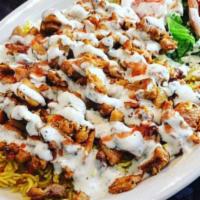 Chicken Over Rice · Chopped, marinated chicken thigh meat, served over flavored basmati rice and fresh vegetable...