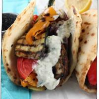 Veg Gyro · Fresh vegetables steamed, tossed in marinara sauce, wrapped in warm pita bread lined with hu...