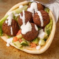 Falafel Gyro  · Deep-fried balls made from ground chickpeas and fava beans, with fresh vegetables, wrapped i...