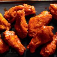 Chicken Wings of Your Choice · 6 fresh chicken wings, fried and tossed in a sauce of your choice.