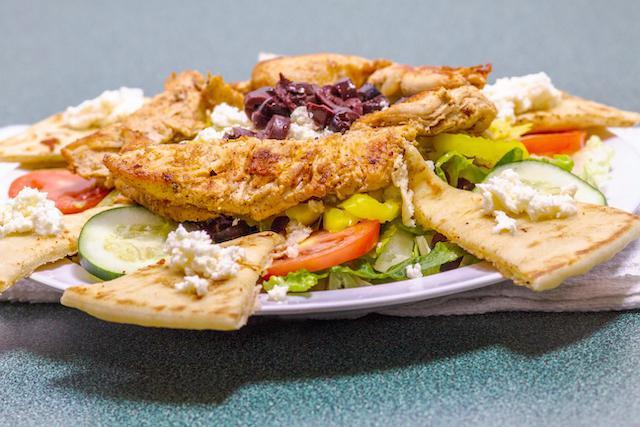 Chicken Delight · Romaine lettuce, Roma tomatoes, red onion, feta cheese, Kalamata olives, pepperoncini and marinated grilled chicken. Served with Greek dressing.
