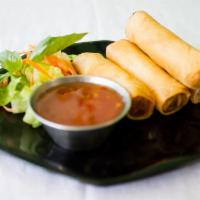 Spring Roll · Crispy vegetable roll served with sweet chili sauce.