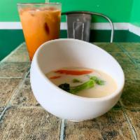 Tom Kha Soup · Onion, mushroom, scallion, and cilantro in creamy coconut lemongrass broth.