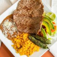 Carne Asada · Rib eye steak grilled, served with slice fresh tomato, onion, avocado and roasted jalapeño p...