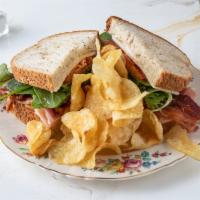 Club Sandwich · Ham, turkey, cheese, bacon, avocado, lettuce and tomato.