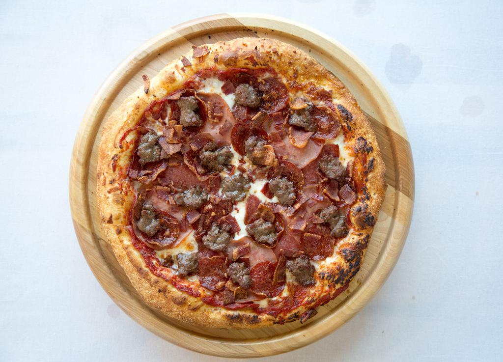 La Carnivore Pizza · Red sauce, mozzarella cheese, pepperoni, salami, Canadian bacon, sausage, crispy bacon.