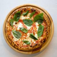Margherita Pizza · Red sauce, Parmesan cheese, fresh mozzarella cheese, tomatoes, fresh basil. Vegetarian.