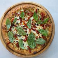 Caprese Pizza · Pesto sauce, Parmesan cheese, mozzarella cheese, Roma and sun-dried tomatoes, fresh mozzarel...