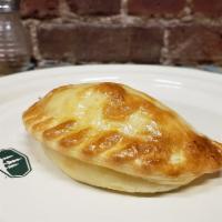 Ham and Cheese Empanada (H) · House blend of cheeses, ham and oregano