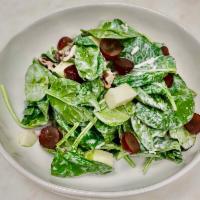 Backyard Salad · Baby spinach, aged white cheddar, spiced pecans, apples, and grapes. Served with buttermilk ...