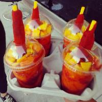 mangonada · frozen mango   , Tajin   , chamoy 