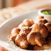 Truffle Garlic Knots · Hand-knotted pizza dough tossed with truffle olive oil, fresh garlic, and Pecorino Romano ch...