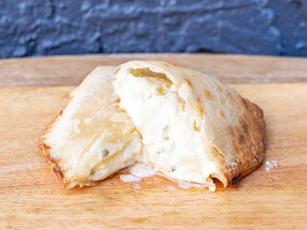 3 Cheese Empanada · Mozzarella, provolone, ricotta cheese, hint of garlic.
