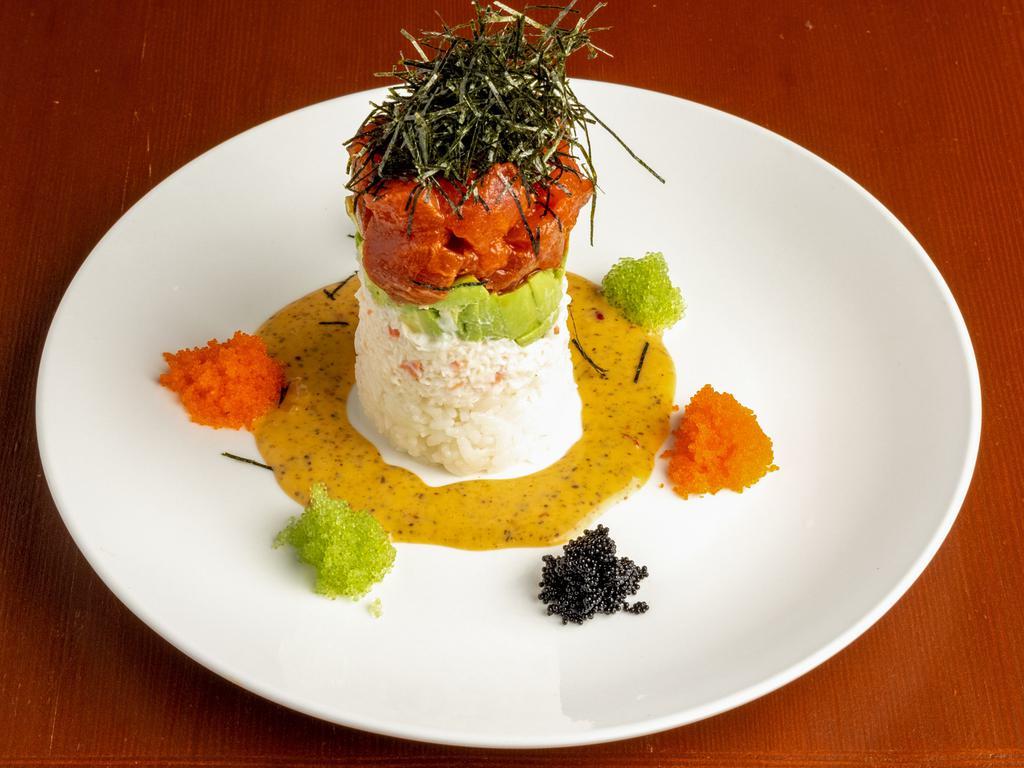 Ahi Tower Plate · Layered spicy sesame tuna, avocado, crab salad, rice, creamy wasabi, and tobiko.