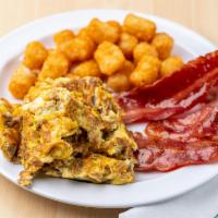 Breakfast Platter · Served with homemade Belgian waffle, 3 eggs, 2 slices of bacon and a side of syrup.