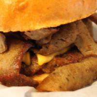 Gyro Burger · 1/2 lb. Gyro meat, hamburger patty, American cheese, gyro sauce, ketchup and pickle.