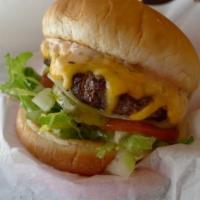 Mac Burger  · 1/2 lb. Angus patty, lettuce, tomato, onion, pickle, 1000 island sauce and American cheese.