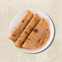 Whole Wheat Flatbread (Vegan) · Whole wheat flatbread layered with butter
