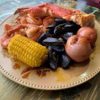 Combo A · 1/2 lb. black mussel, 1/2 lb. shrimp no head, 1/2 lb. snow crab legs with 1 corn, 2 potatoes.