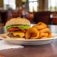 The All American Burger · 1/2 lb. patty, cheese, lettuce, tomato, onion, and pickle.
