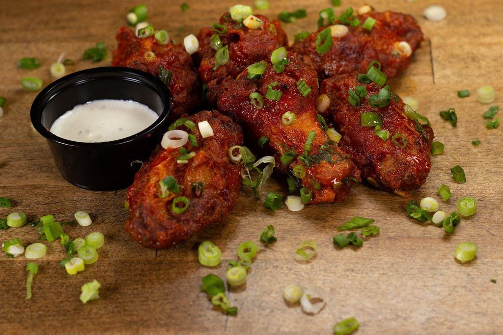 WINGS · crispy fried wings served with a dipping sauce