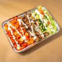Combo Over Rice · Grilled chicken and lamb served over brown basmati rice with choice of salad and any of shah...