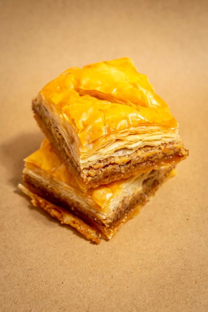 Baklava · Sweet dessert pastry made of layers of filo filled with chopped nuts and sweetened with syrup, frosting and honey.
