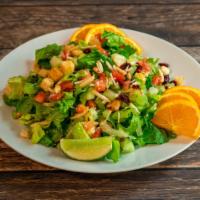 Caesar Salad · Romaine lettuce, tomatoes, carrots and cucumber topped with Parmesan cheese and Caesar dress...