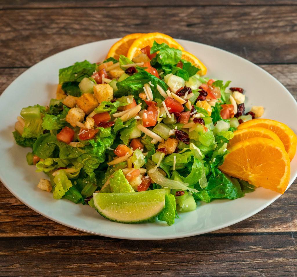 Caesar Salad · Romaine lettuce, tomatoes, carrots and cucumber topped with Parmesan cheese and Caesar dressing.
