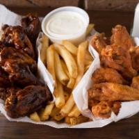 Buffalo Style Chicken Wings · Served with your choice of homemade dressing and either celery or fries.