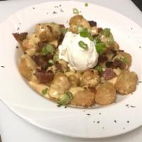 Loaded Tots · Beer cheese, bacon, scallion and sour cream.