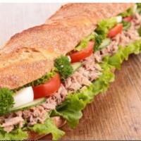 Tuna Salad Club · Tuna salad and bacon with lettuce, tomato and your choice of cheese and dressing.