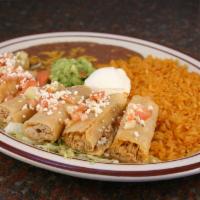 Taquitos Rancheros · Fried chicken taquitos, tomato, cheese, served with rice and beans.