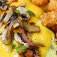 Veggie Omelette · Spinach, mushrooms, green peppers, red peppers, red onion, tomato,  cheddar cheese and avoca...