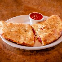 Individual Carnivore Stromboli · Beef, Italian sausage, pepperoni and Canadian bacon. Fresh-made dough stuffed with mozzarell...