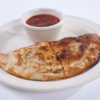 Individual Carnivore Calzone · Beef, Italian sausage, pepperoni and Canadian bacon. Fresh made dough, ricotta and mozzarell...